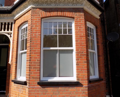 Set of three white timber sash windows