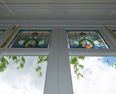 Stained glass panels on bifold doors