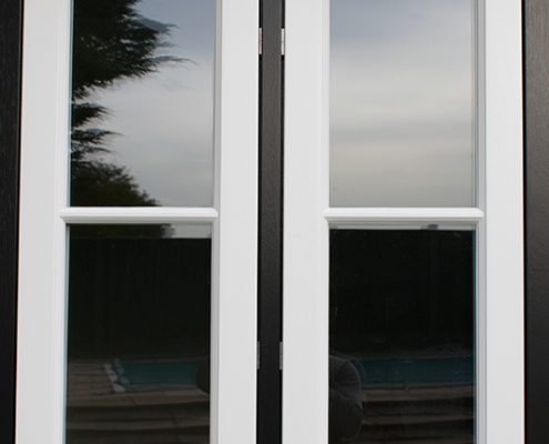 White timber windows in a black frame