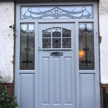 Pale blue timber door with glazing