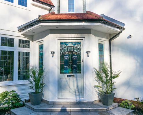 Stained front door and casement window