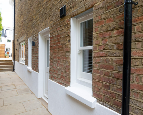 Side view of timber door and windows installation
