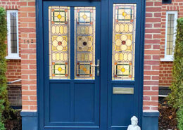 Composite door with stained glass